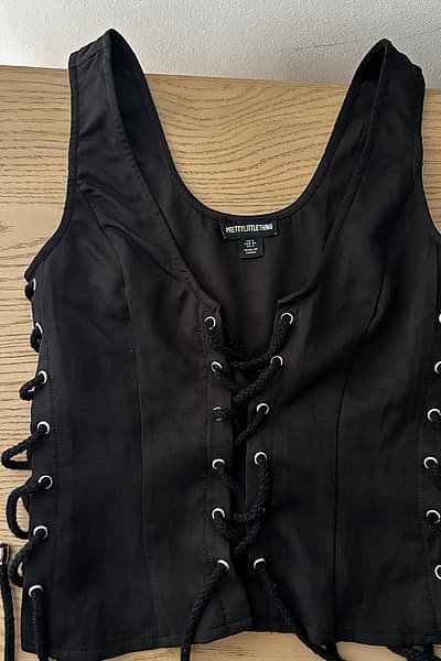Black lace-up sleeveless top by PrettyLittleThing — pre-loved on Thrifted.mt