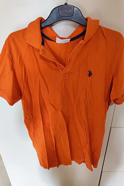 Polo naranja — pre-loved on Thrifted.mt