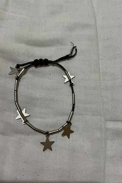 Braccialetto con cordino e ciondolo a stella d'argento — pre-loved on Thrifted.mt